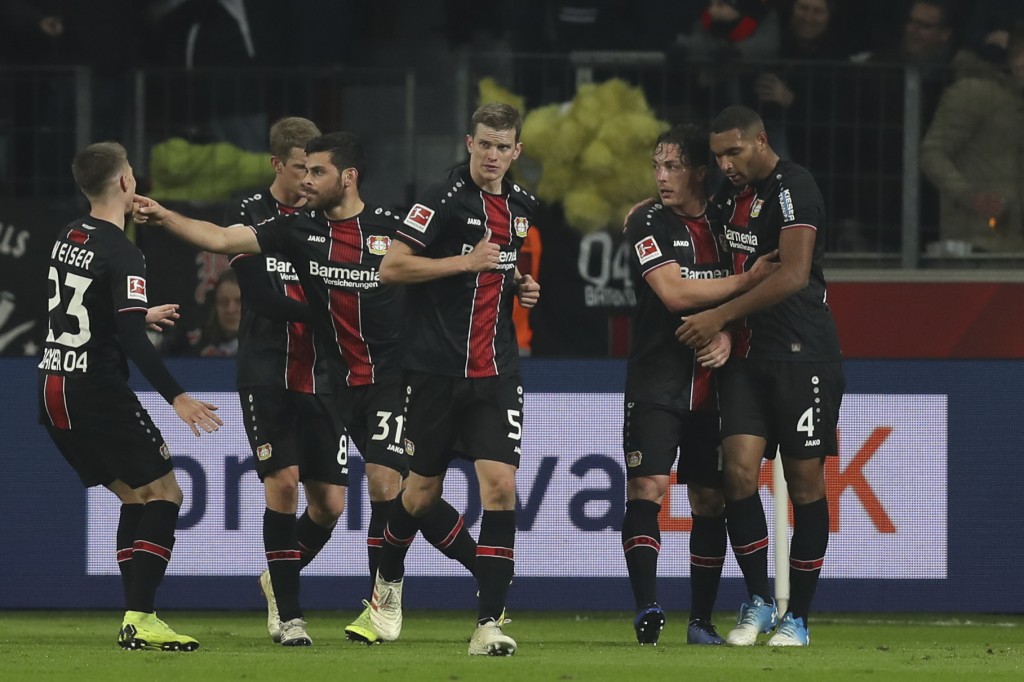 LEVERKUSEN, GERMANY - NOVEMBER 23: Kevin Volland #31 of Bayer Leverkusen celebrates with teammates after scoring his team's first goal during the Bundesliga match between Bayer 04 Leverkusen and VfB Stuttgart at BayArena on November 23, 2018 in Leverkusen, Germany. (Photo by Maja Hitij/Bongarts/Getty Images)