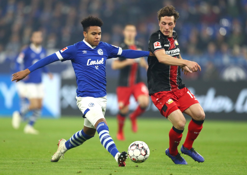GELSENKIRCHEN, GERMANY - DECEMBER 19: Weston McKennie of FC Schalke 04 battles for possession with Julian Baumgartlinger of Bayer 04 Leverkusen during the Bundesliga match between FC Schalke 04 and Bayer 04 Leverkusen at Veltins-Arena on December 19, 2018 in Gelsenkirchen, Germany. (Photo by Lars Baron/Bongarts/Getty Images)