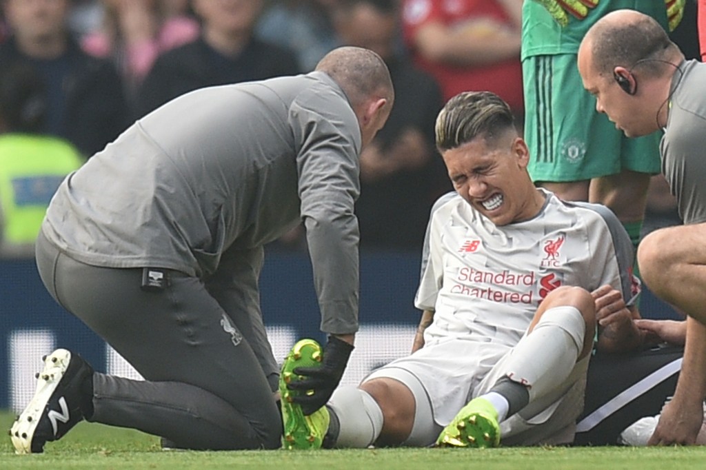Firmino came off injured on Sunday (Photo by OLI SCARFF/AFP/Getty Images)