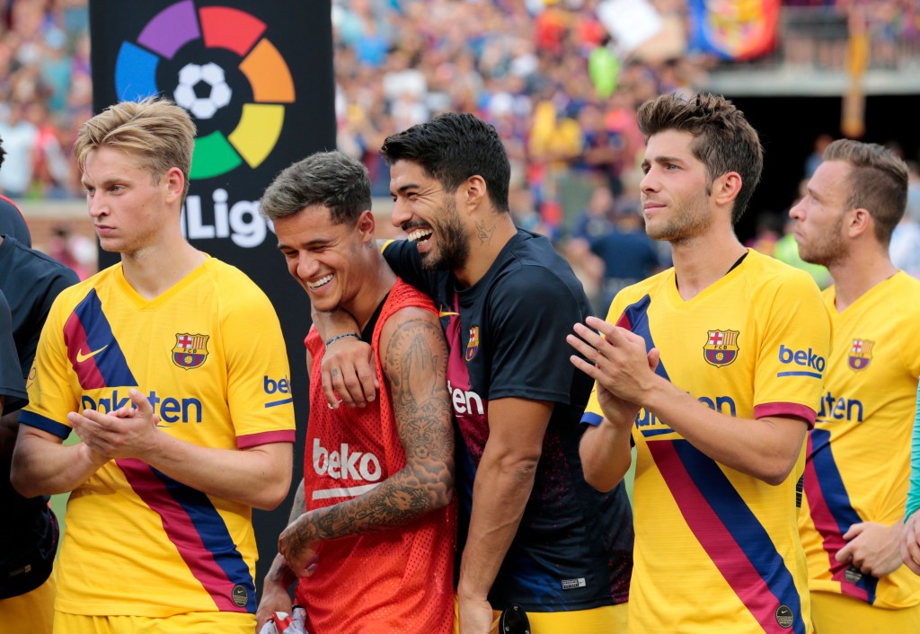 Coutinho (2nd from left) is not going anywhere. (Photo by Jeff Kowalsky/AFP/Getty Images)