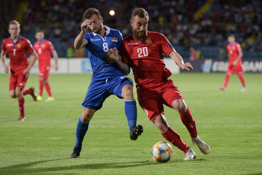 Liechtenstein's midfielder Aron Sele and Armenia's forward Aleksandr Karapetyan vie for the ball during the Euro 2020 football qualification match between Armenia and Liechtenstein in Yerevan on June 8, 2019. (Photo by KAREN MINASYAN / AFP) (Photo credit should read KAREN MINASYAN/AFP/Getty Images)