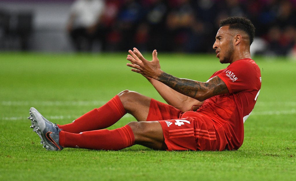Bayern Munich's French midfielder Corentin Tolisso ends up on the grass after a foul during the German First division Bundesliga football match FC Bayern Munich v Hertha Berlin in Munich, southern Germany, on August 16, 2019. (Photo by Christof STACHE / AFP) / DFL REGULATIONS PROHIBIT ANY USE OF PHOTOGRAPHS AS IMAGE SEQUENCES AND/OR QUASI-VIDEO (Photo credit should read CHRISTOF STACHE/AFP/Getty Images)