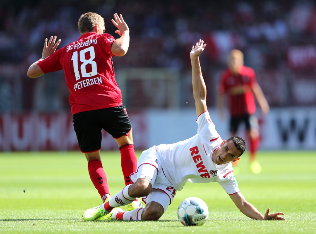 FREIBURG IM BREISGAU, GERMANY - AUGUST 31: Ellyes Skhiri of 1. FC Koln battles for possession with Nils Petersen of Sport-Club Freiburg during the Bundesliga match between Sport-Club Freiburg and 1. FC Koeln at Schwarzwald-Stadion on August 31, 2019 in Freiburg im Breisgau, Germany. (Photo by Simon Hofmann/Bongarts/Getty Images)