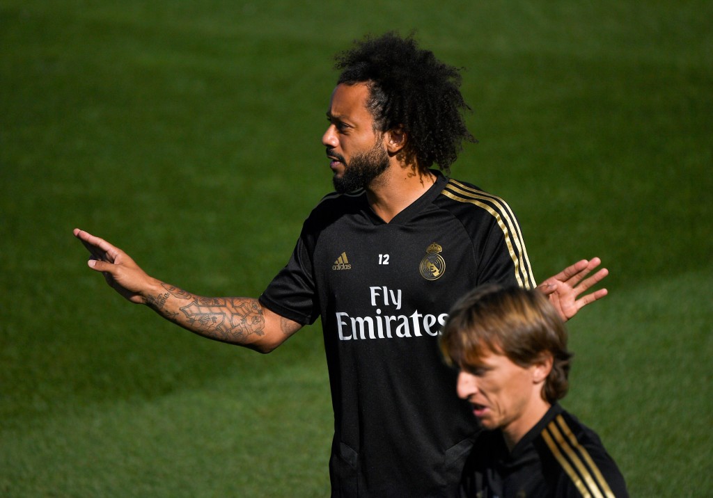 Marcelo and Modric are back in training (Photo by PIERRE-PHILIPPE MARCOU/AFP/Getty Images)