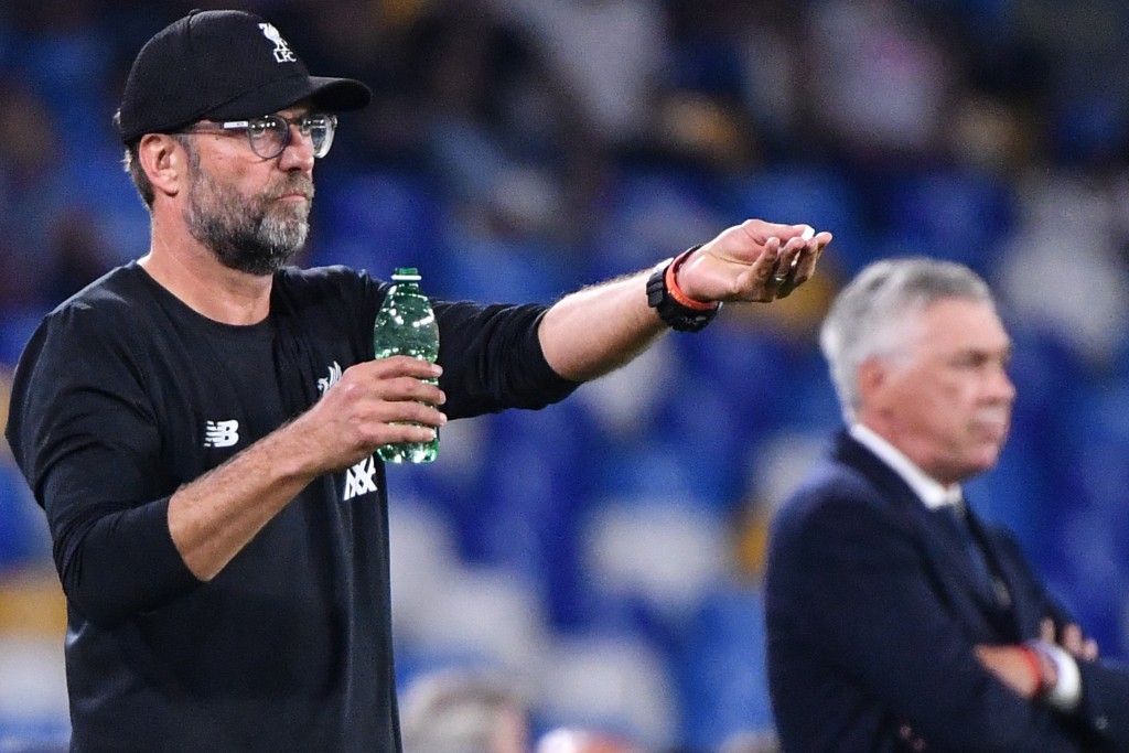 Liverpool are chasing an unprecedented quadruple this season (Photo by Alberto PIZZOLI / AFP) (Photo credit should read ALBERTO PIZZOLI/AFP via Getty Images)