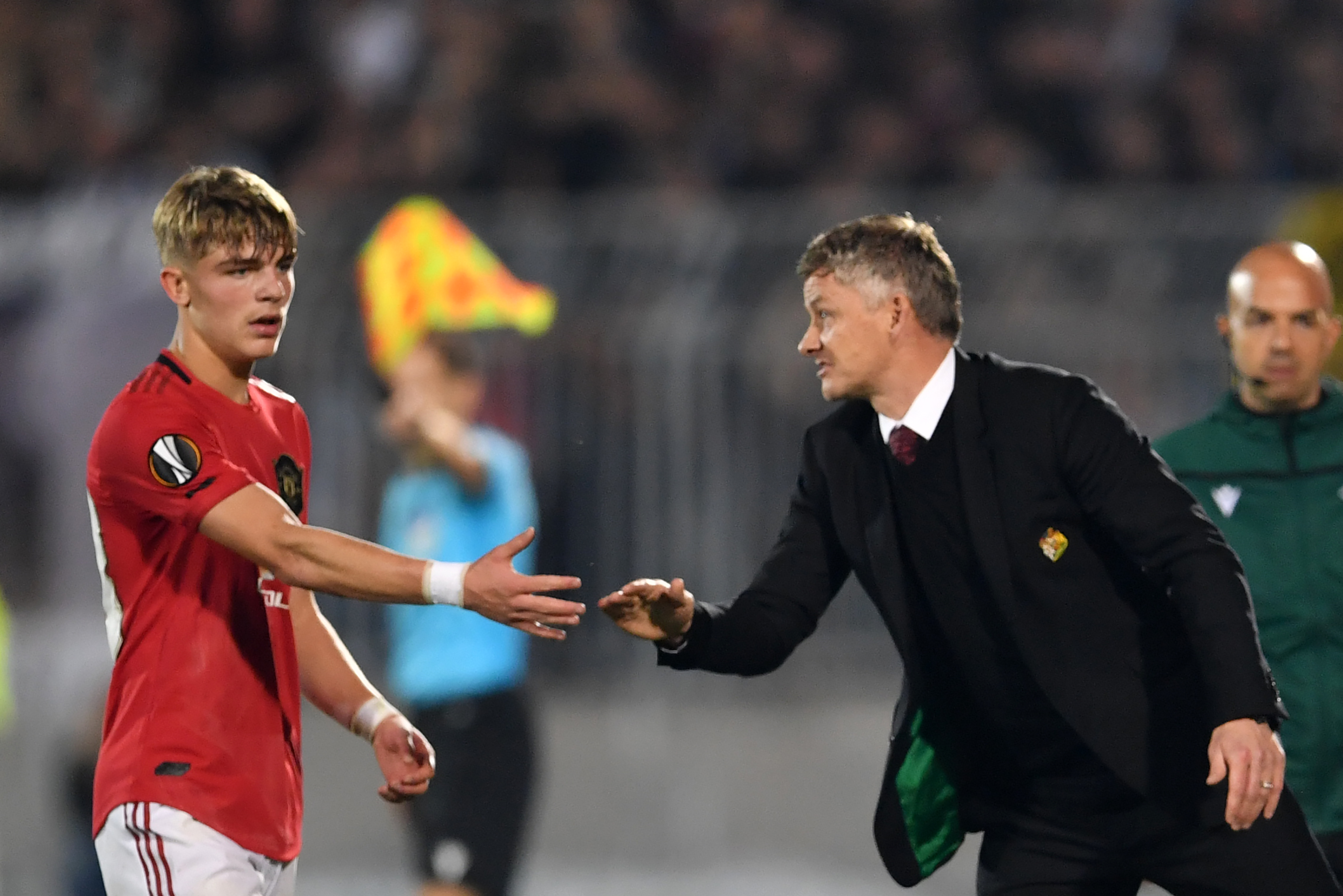 Manchester United's Norwegian manager Ole Gunnar Solskjaer substitutes Machester United's English midfeilder James Garner (L) during the UEFA Europa league group L football match between Partizan Belgrade and Manchester United at the Partizan stadium in Belgrade on October 24, 2019. (Photo by ANDREJ ISAKOVIC / AFP) (Photo by ANDREJ ISAKOVIC/AFP via Getty Images)