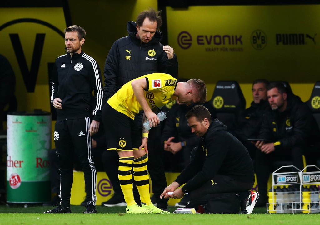 DORTMUND, GERMANY - NOVEMBER 02: Marco Reus of Borussia Dortmund receives medical treatment during the Bundesliga match between Borussia Dortmund and VfL Wolfsburg at Signal Iduna Park on November 02, 2019 in Dortmund, Germany. (Photo by Lars Baron/Bongarts/Getty Images)