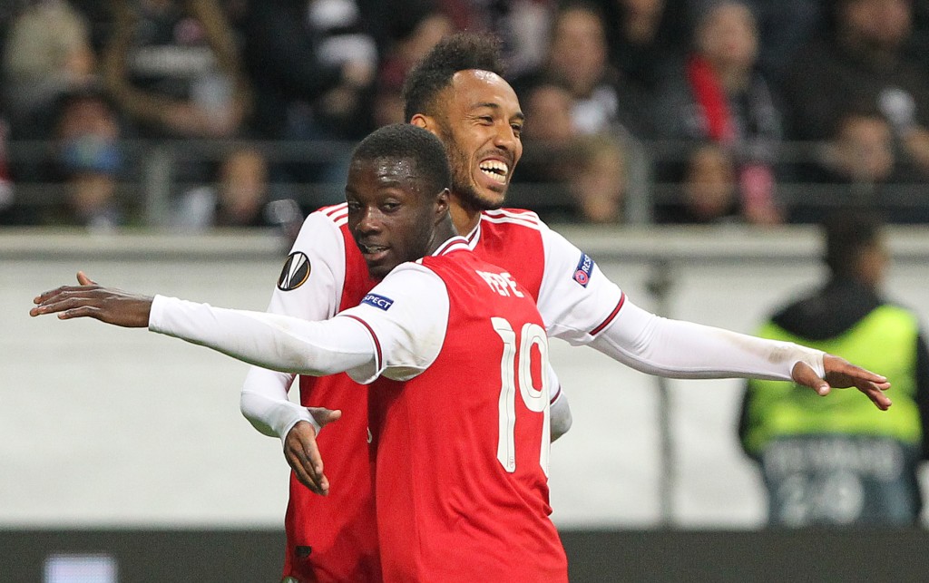 Arsenal's Gabonese striker Pierre-Emerick Aubameyang (L) celebrates scoring the 0-3 with his team-mate French-born Ivorian midfielder Nicolas Pepe during the UEFA Europa League Group F football match Eintracht Frankfurt v Arsenal in Frankfurt am Main, western Germany, on September 19, 2019. (Photo by Daniel ROLAND / AFP) (Photo credit should read DANIEL ROLAND/AFP via Getty Images)