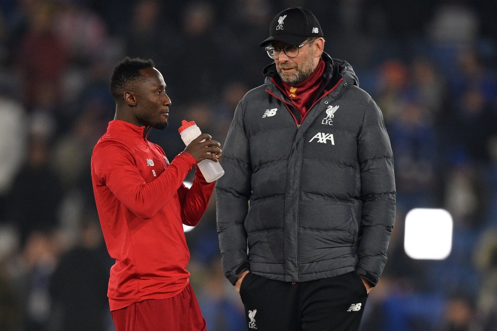 Liverpool's German manager Jurgen Klopp speaks with Liverpool's Guinean midfielder Naby Keita (L) on the pitch before the English Premier League football match between Leicester City and Liverpool at King Power Stadium in Leicester, central England on December 26, 2019. (Photo by Oli SCARFF / AFP) / RESTRICTED TO EDITORIAL USE. No use with unauthorized audio, video, data, fixture lists, club/league logos or 'live' services. Online in-match use limited to 120 images. An additional 40 images may be used in extra time. No video emulation. Social media in-match use limited to 120 images. An additional 40 images may be used in extra time. No use in betting publications, games or single club/league/player publications. / (Photo by OLI SCARFF/AFP via Getty Images)