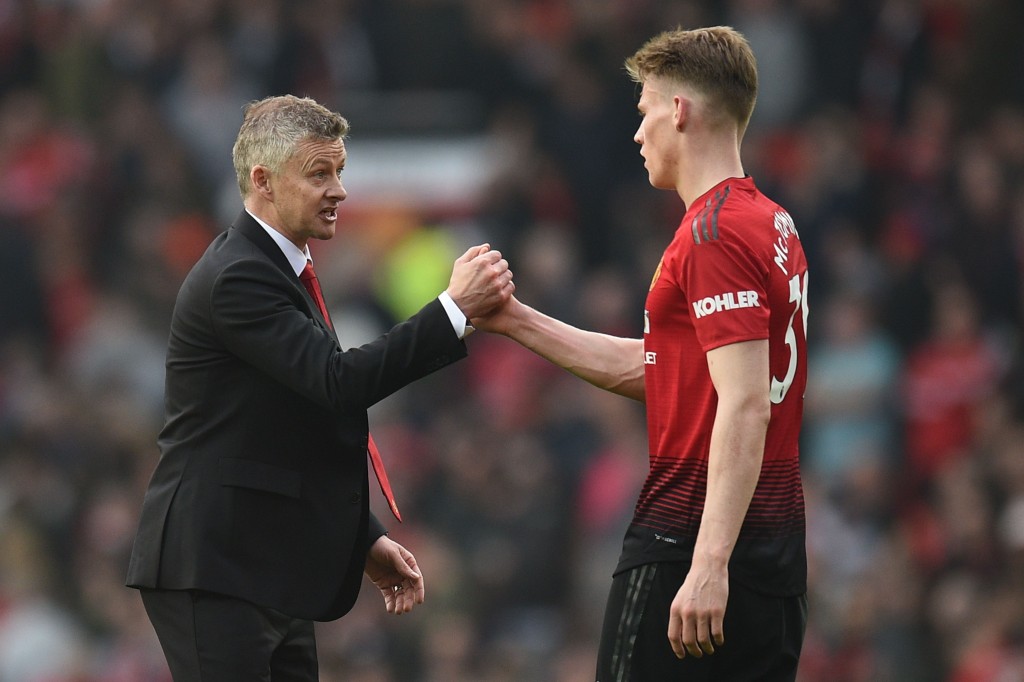 Manchester United's Norwegian caretaker manager Ole Gunnar Solskjaer (L) shakes hands with Manchester United's English midfielder Scott McTominay (R) after the final whistle of the English Premier League football match between Manchester United and Liverpool at Old Trafford in Manchester, north west England, on February 24, 2019. (Photo by Oli SCARFF / AFP) / RESTRICTED TO EDITORIAL USE. No use with unauthorized audio, video, data, fixture lists, club/league logos or 'live' services. Online in-match use limited to 120 images. An additional 40 images may be used in extra time. No video emulation. Social media in-match use limited to 120 images. An additional 40 images may be used in extra time. No use in betting publications, games or single club/league/player publications. / (Photo Oli Scarff/AFP via Getty Images)