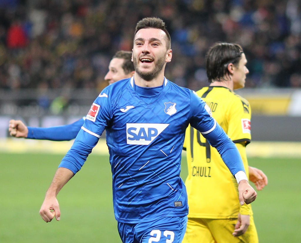 Hoffenheim's Armenian striker Sargis Adamyan celebrate scoring the 1-1 equalizer during the German First division Bundesliga football match TSG 1899 Hoffenheim v BVB Borussia Dortmund in Sinsheim, southern Germany, on December 20, 2019. (Photo by Daniel ROLAND / AFP) / DFL REGULATIONS PROHIBIT ANY USE OF PHOTOGRAPHS AS IMAGE SEQUENCES AND/OR QUASI-VIDEO (Photo by DANIEL ROLAND/AFP via Getty Images)