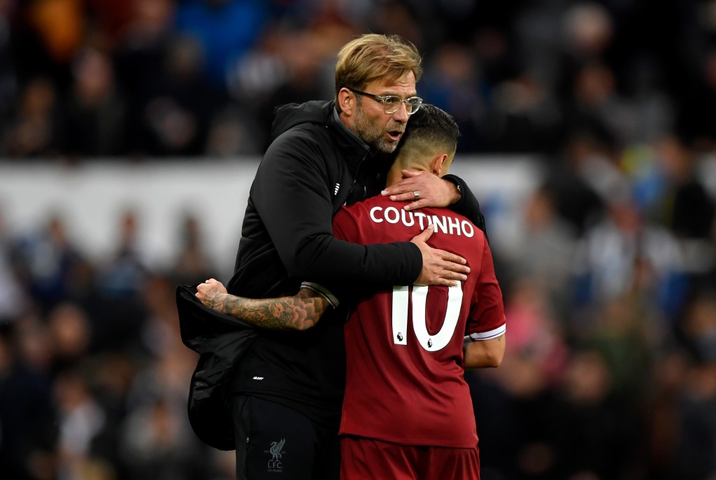 NEWCASTLE UPON TYNE, ENGLAND - OCTOBER 01: Jurgen Klopp, Manager of Liverpool and Philippe Coutinho of Liverpool embrace after the Premier League match between Newcastle United and Liverpool at St. James Park on October 1, 2017 in Newcastle upon Tyne, England. (Photo by Stu Forster/Getty Images)
